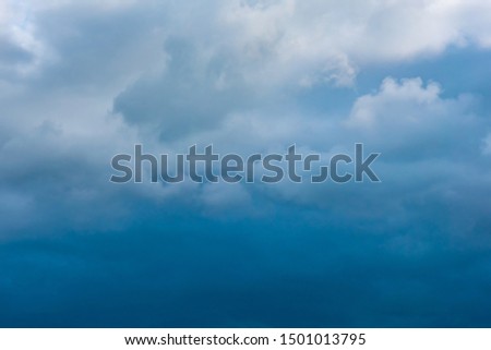 Image of blue sky with whiye cloud and dark raincloud on day time before rain .
