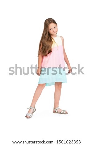A full length portrait of a young pretty girl. Kids summer casual fashion.