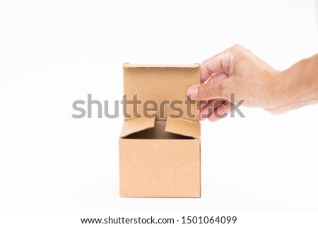 Man hand holding brown paper box on white background