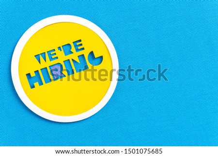 We are hiring button design on blue textured background with space for text