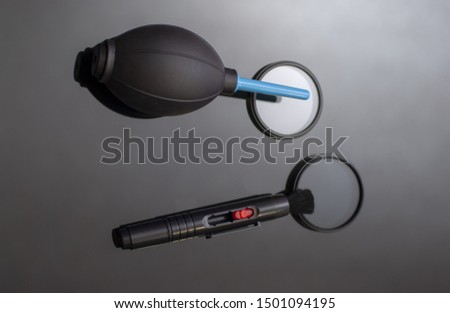 pear and pencil for dusting camera lenses, keyboards, lenses and glasses