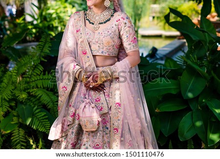 Pakistani Indian Bridal wearing wedding Lehenga sharara and jewelry Royalty-Free Stock Photo #1501110476