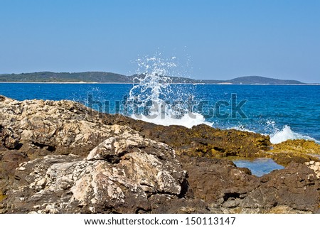Beautiful Seascape. Deep Blue Sea, Mountain And Sky. High quality stock photo.