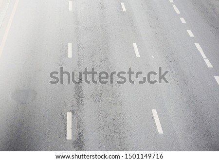 gray road with white lines