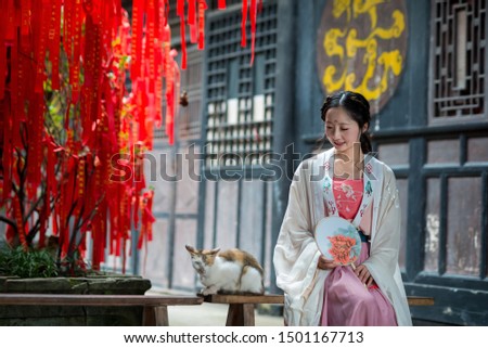 Chinese ancient beauty wearing Chinese clothes play in the Chinese Taoist Taoist Temple.