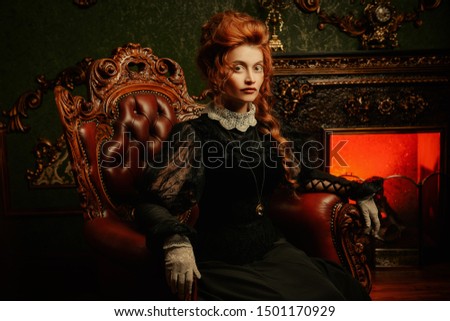 The Victorian era concept. Beautiful woman in elegant historical dress and hairstyle posing in vintage interior. Baroque. Fashion. Royalty-Free Stock Photo #1501170929