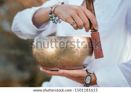 Tibetan singing bowl in sound therapy close up Royalty-Free Stock Photo #1501181615