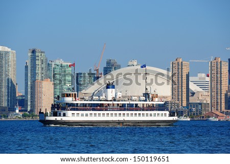 Toronto skyline with boat, urban architecture and blue sky 