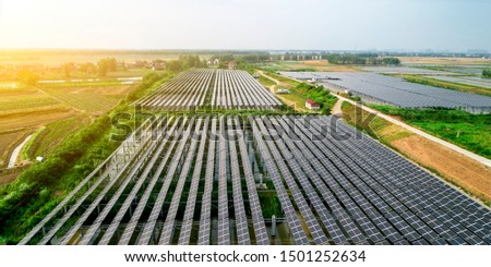Aerial large-scale lotus pond solar photovoltaic panels in the Asian countryside