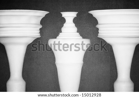 Optical illusion created by clay columns forming shapes of two ladies talking Royalty-Free Stock Photo #15012928