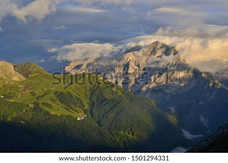 Marmolada - the highest mountain range in the Dolomites. Situated between Veneto and Trentino. Picture was taken during the sunset after heavy rain. Magical clouds.