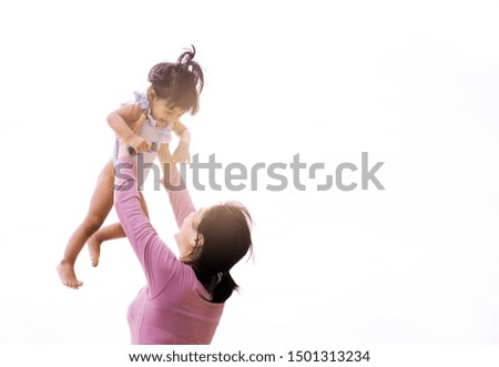Happy  mother and baby having daughter on a white background.