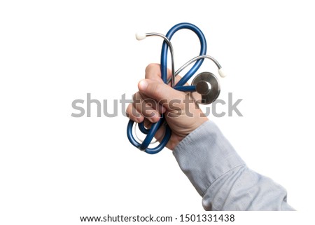 Man in blue shirt hold tight a stethoscope in the hand
