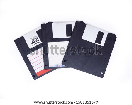 Three floppy disk with blank label on white background