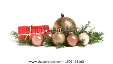 Christmas tree branches and festive decoration on white background