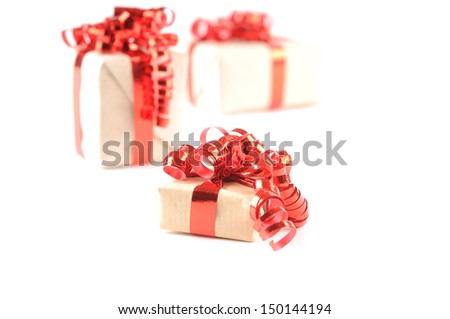 Three Christmas presents on a white background
