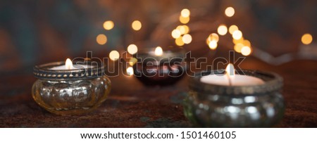 Atmospheric christmas candlelight with festive golden bokeh effects