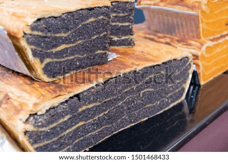 Traditional poppy seeds pie sweet dessert delights, pastry during hotel brunch buffet outside outdoor in the garden by the pool. Fresh Food Buffet Brunch Catering Dining Eating Party Sharing Concept