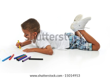 Biracial boy coloring isolated on a white background