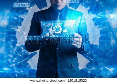 The abstract image of businessman point to the hologram on his smartphone and blurred cityscape is backdrop. the concept of communication network, cyber security, internet of things and future life.