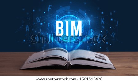 BIM inscription coming out from an open book, digital technology concept