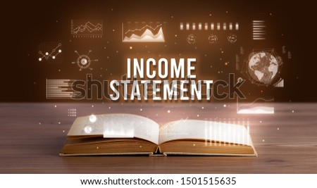 INCOME STATEMENT inscription coming out from an open book, creative business concept