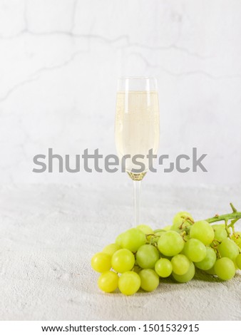 Bottle of Champagne With grapes