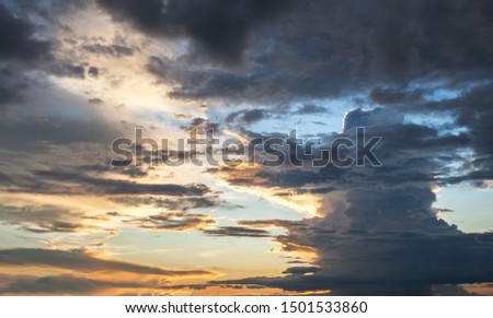 The vast Beautiful sky and four orange clouds that are beautiful sky before sunset. The natural sky before background has a breeze on a bright day in the summer.