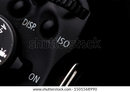 iso button on a camera shot on a black background  Royalty-Free Stock Photo #1501568990