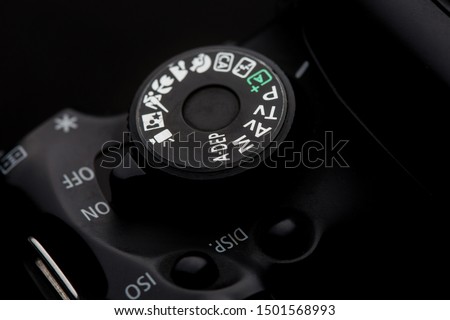 closeup of the Camera Modes
wheel on a camera shot on a black background Royalty-Free Stock Photo #1501568993
