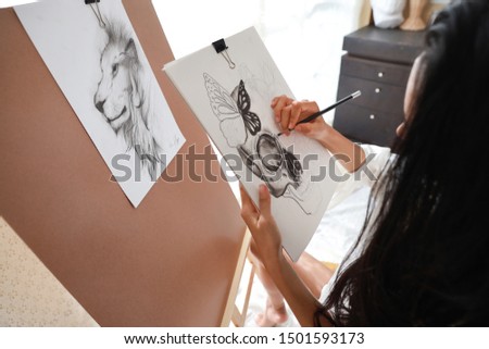 asian artist hands in white shirt drawing picture with pencil (woman lifestyle concept)