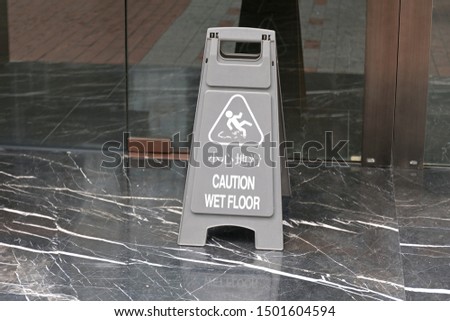 Wet Floor Caution Board at Marble Floor