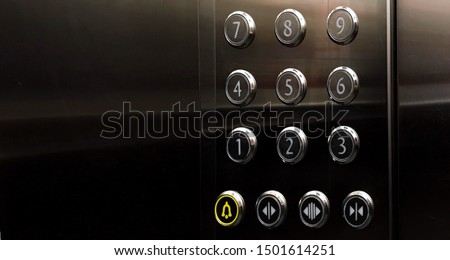 Close up of silver buttons in elevator