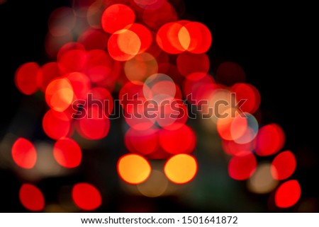Defocused abstract red bokeh background.