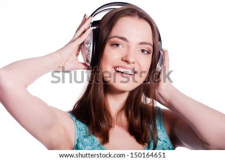 Girl With Headphones Singing and Dancing  On White Background