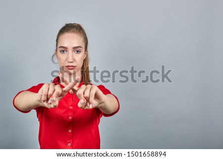 girl brunette in red blouses over isolated white background shows emotions