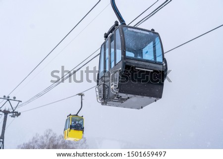 Gondola for people who play ski in winter season , bring people to top of mountain 