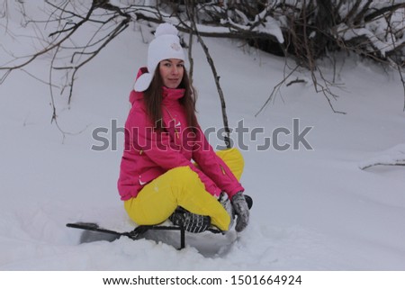 Happy young woman enjoys snow  at new winter season.