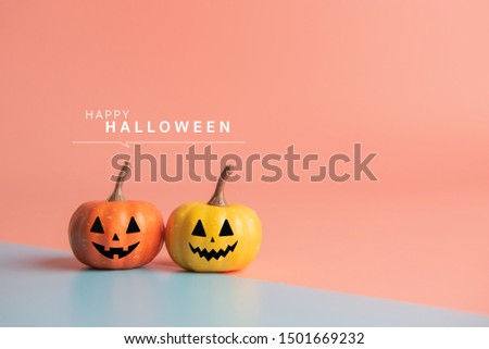 Happy Halloween message, Pumpkin on pastel paper background.
