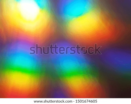 Rainbow abstract glowing light colorful defocused background.