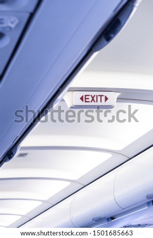 Exit sign aircraft in an aircraft interior.