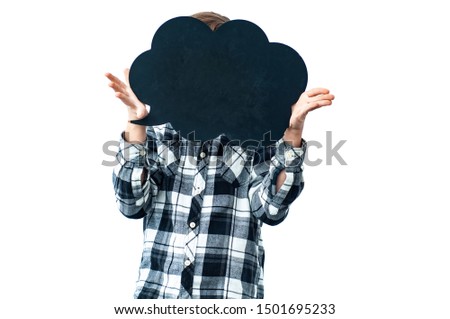 The child teenager holds in his hands the symbol of thoughts in the form of a cloud of chalk board. Free space for the text recording. A cloud instead of a head. Isolated