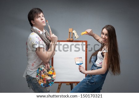 man and woman painters emotionally discussing art project