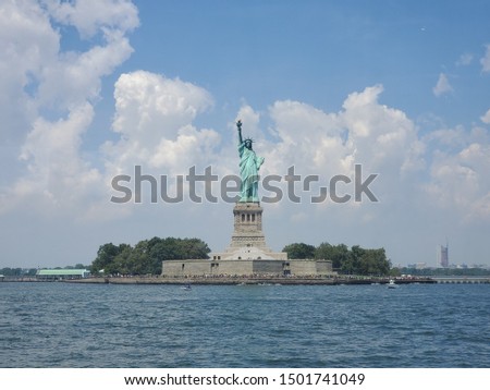 statue of liberty as seen by boat cruise