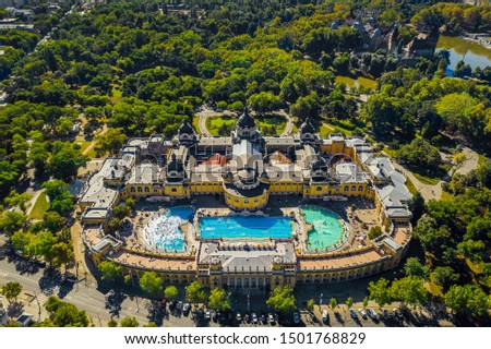 Budapest, Hungary - Aerial drone view of the famous Szechenyi Thermal Bath and Spa in City Park (Varosliget) taken from high above on a sunny summer day. Vajdahunyad Castle at background Royalty-Free Stock Photo #1501768829