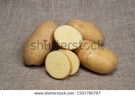 Potatoes. Fresh potatoes. Potatoes on a jute bag with natural product appearance for product food photography