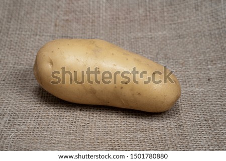 Potatoes. Fresh potatoes. Potatoes on a jute bag with natural product appearance for product food photography