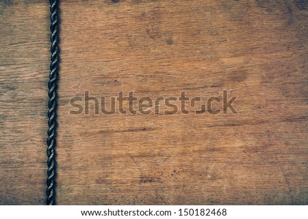 Old wood board textured background with cord