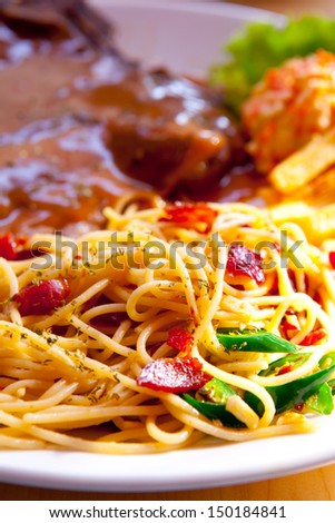 Picture of steak with pasta and veggies.