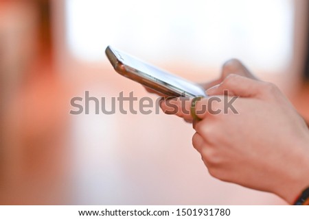 close up of a women using mobile smart phone